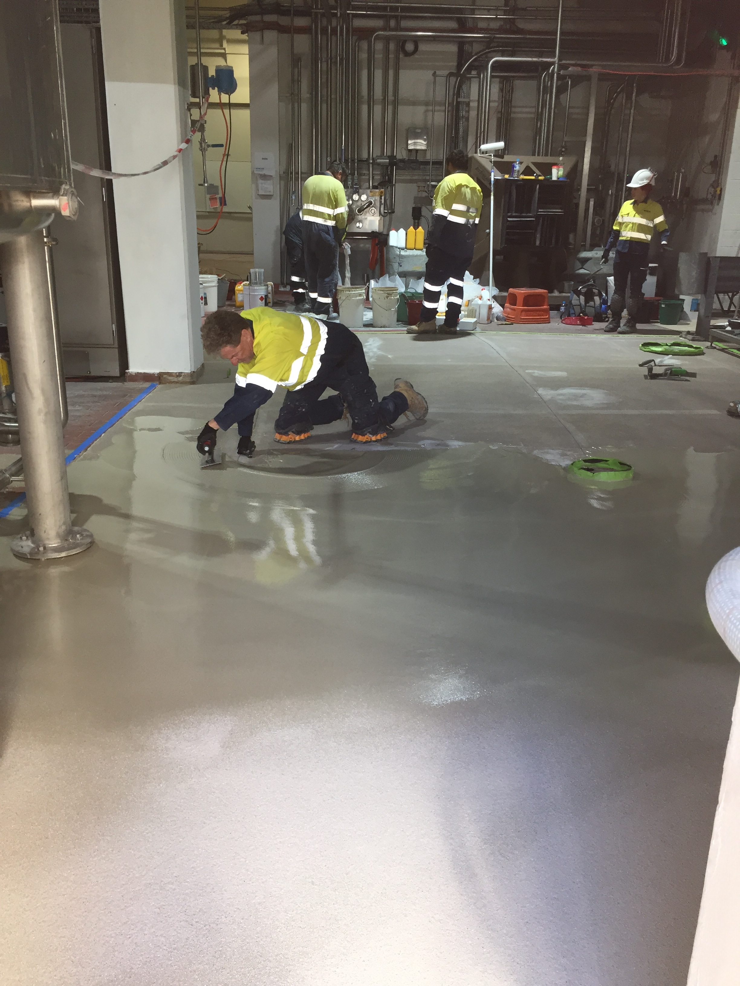 Warehouse concrete floor during dust-free shot blasting with industrial vacuum extraction by SCS Perth