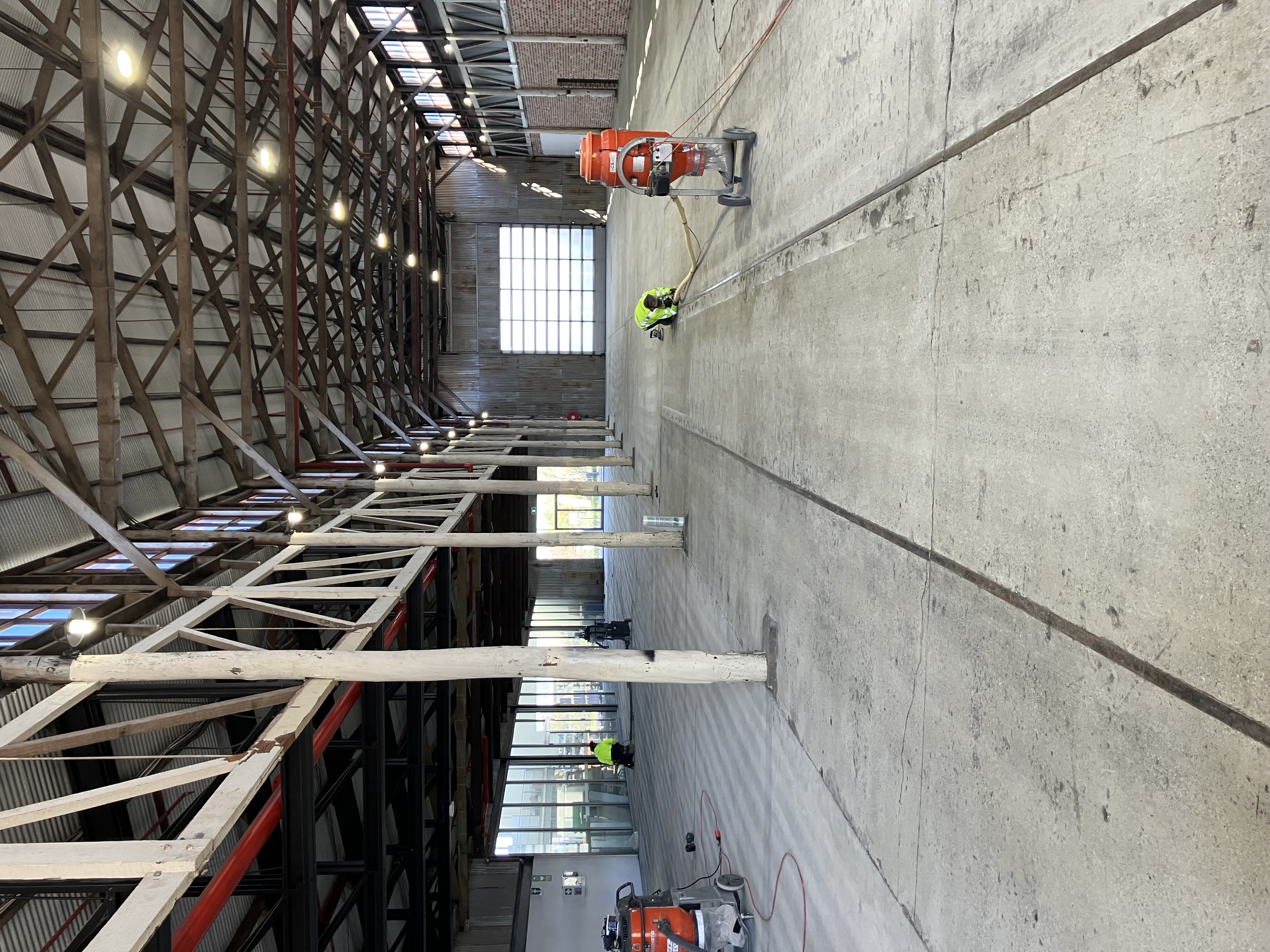Large industrial warehouse concrete floor fully prepared and ready for epoxy flooring installation in Perth
